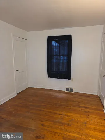 a view of wooden floor and utility room