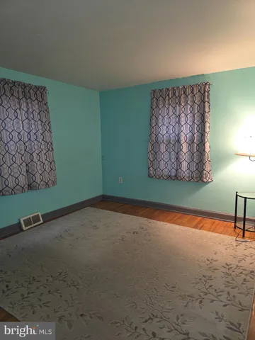 an empty room with closet area