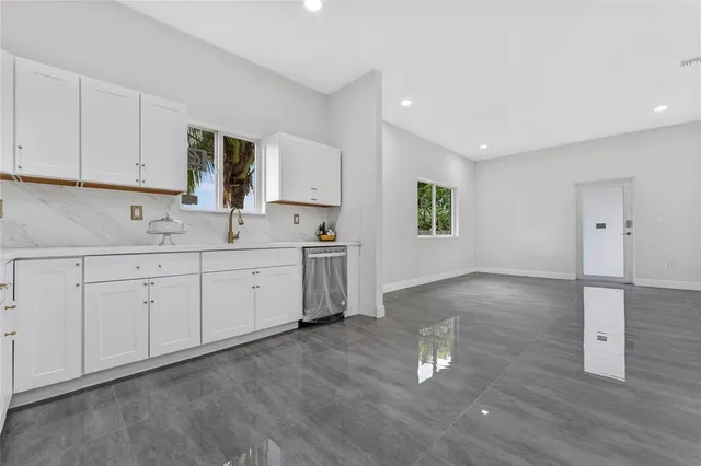 a view of a kitchen with wooden floor