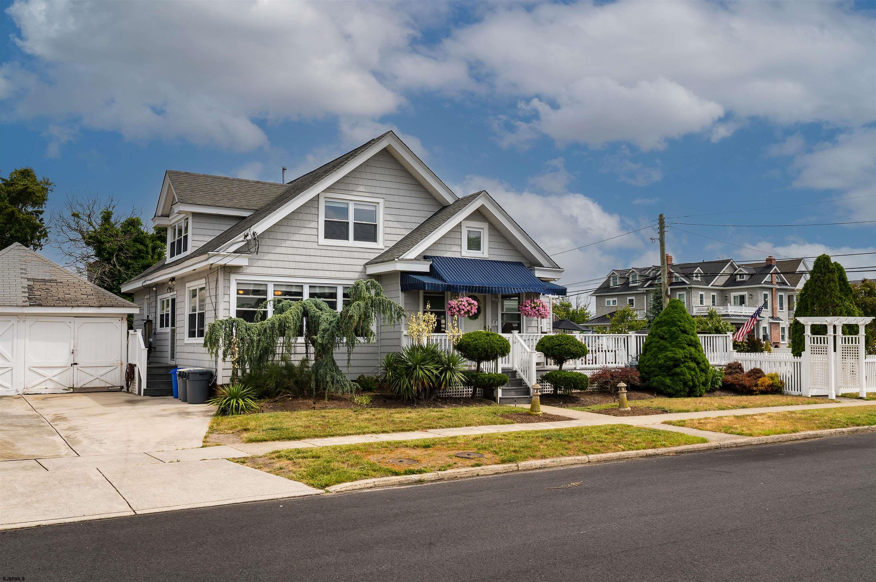 34 Ocean Road Ocean City, NJ 08226 - Photo 3 of 33 a front view of a house with a yard