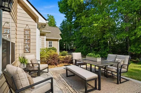 a view of a patio with a couple of chairs and a table