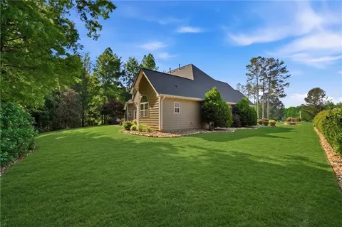 a front view of a house with garden