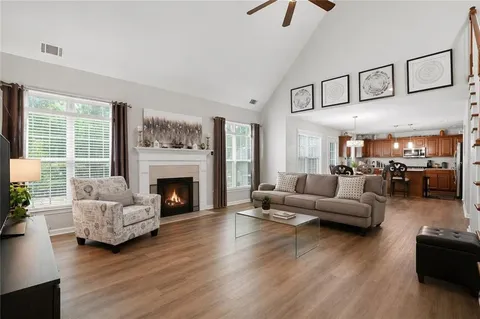 a living room with furniture or fireplace and a wooden floor
