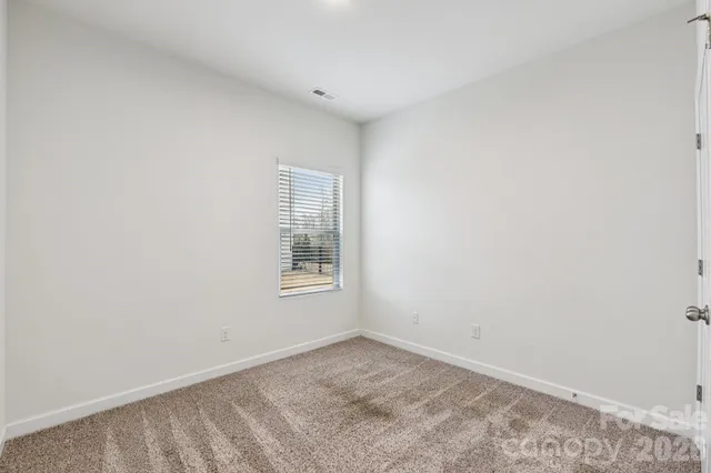 a view of a room that has a window in it