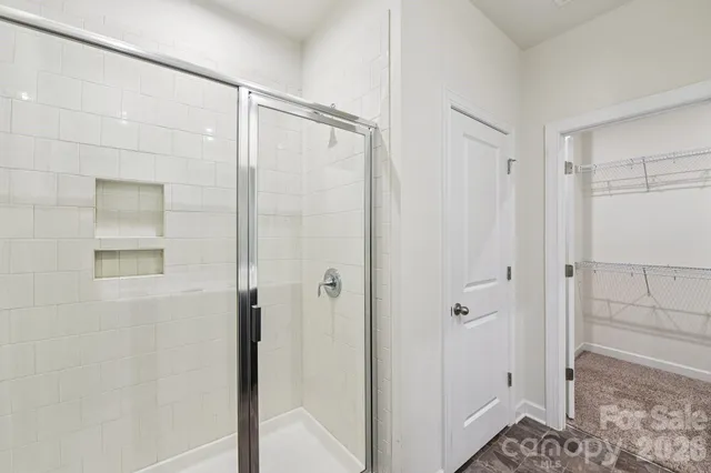 a bathroom with a shower and a sink