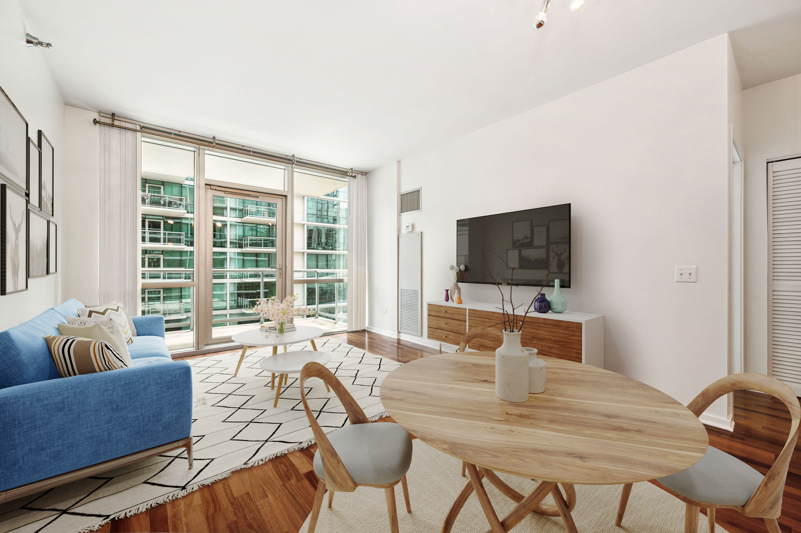 123 South Green Street, Unit 407B Chicago, IL 60607 - Photo 2 of 20 a living room with furniture and a flat screen tv