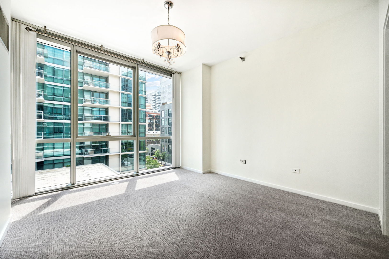 123 South Green Street, Unit 407B Chicago, IL 60607 - Photo 10 of 20 a view of an empty room with a window