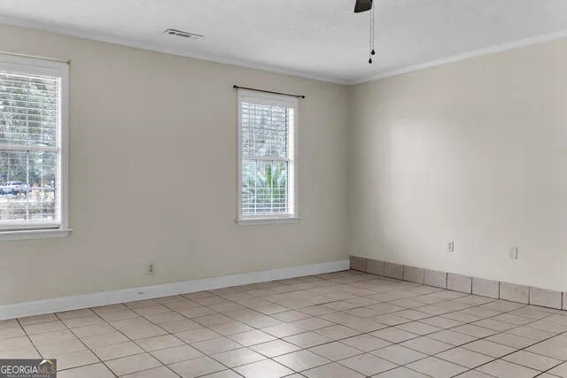 an empty room with windows