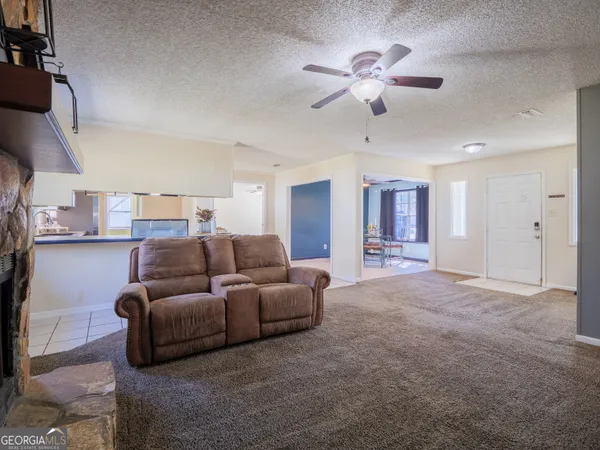 a kitchen with stainless steel appliances granite countertop a stove a sink dishwasher and a refrigerator