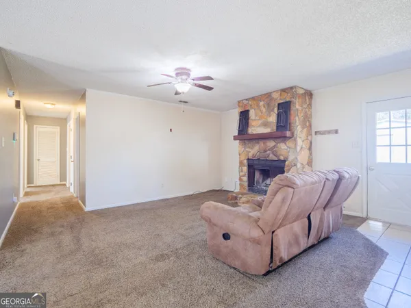 a kitchen with a sink a stove top oven and cabinetry