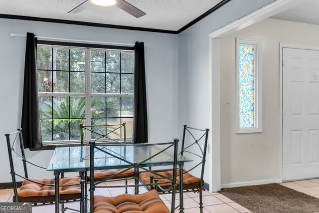 a view of a dining room with furniture window and outside view