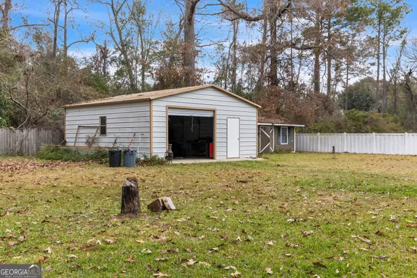a kitchen with stainless steel appliances granite countertop a refrigerator and a stove