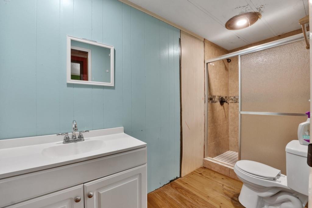 9503 Tails Creek Road Ellijay, GA 30540 - Photo 20 of 30 a bathroom with a sink toilet and shower