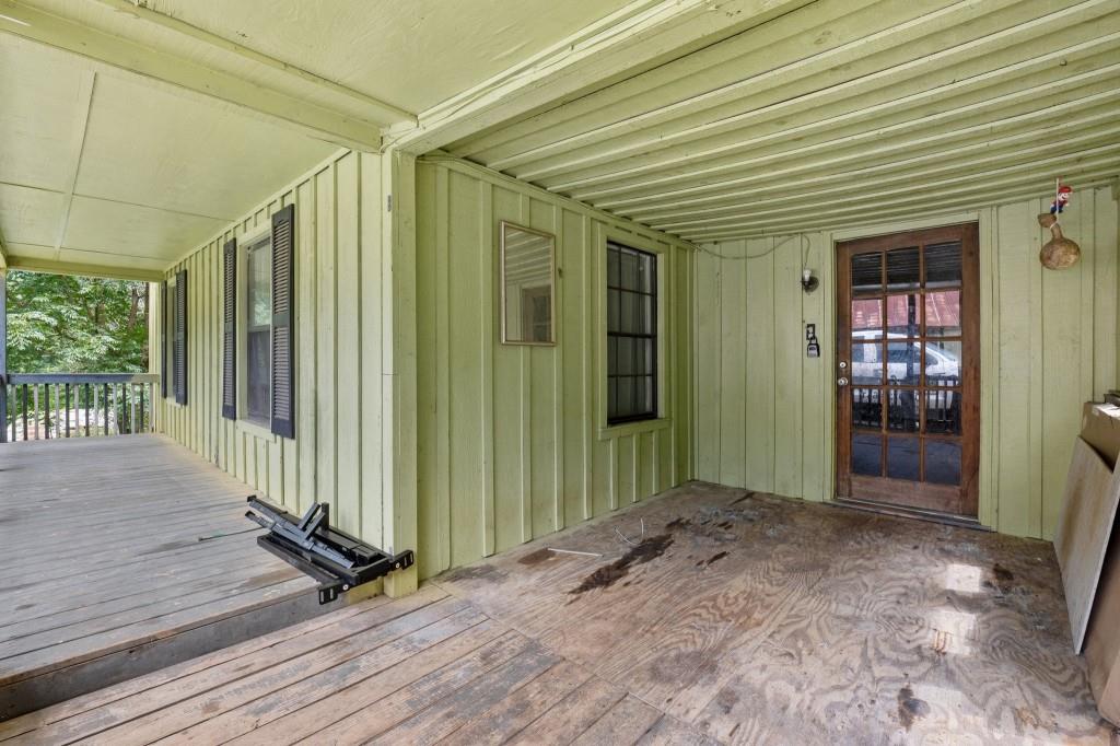 9503 Tails Creek Road Ellijay, GA 30540 - Photo 23 of 30 an empty room with wooden floor and windows