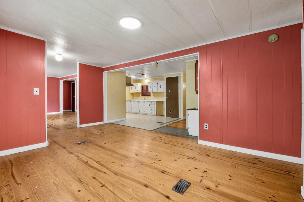 9503 Tails Creek Road Ellijay, GA 30540 - Photo 6 of 30 a view of an empty room with wooden floor and a bathroom