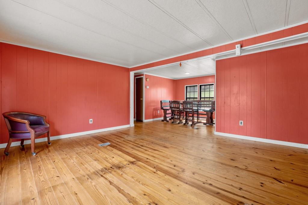 9503 Tails Creek Road Ellijay, GA 30540 - Photo 8 of 30 a room with furniture and wooden floor