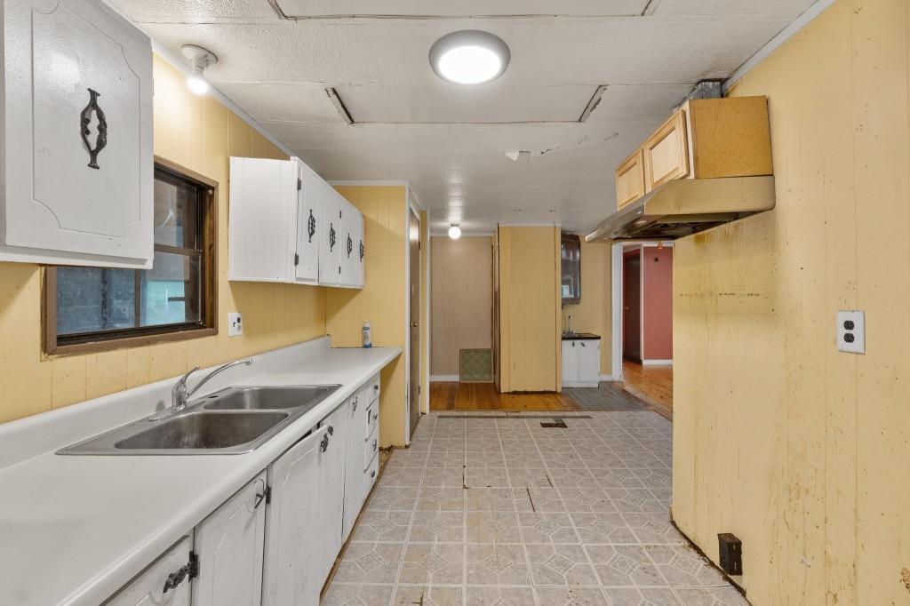 9503 Tails Creek Road Ellijay, GA 30540 - Photo 10 of 30 a kitchen with a sink a stove and cabinets