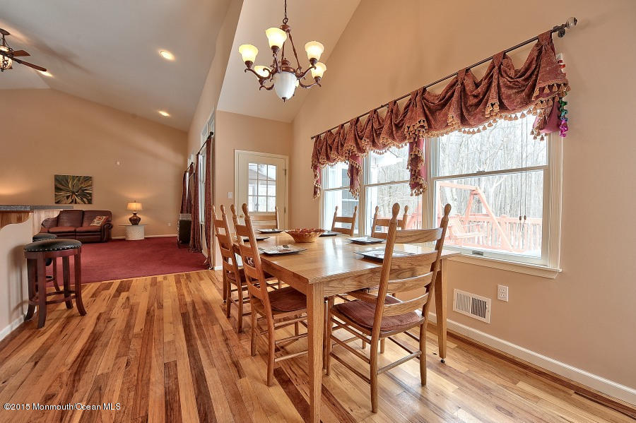 33 Larrison Road Wrightstown, NJ 08562 - Photo 11 of 35 a view of a dining room with furniture window and wooden floor