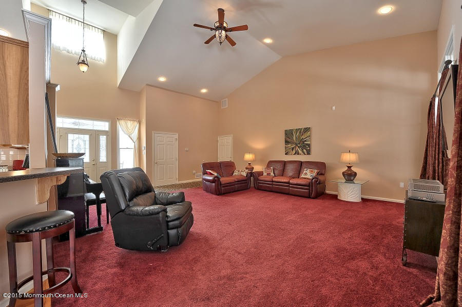 33 Larrison Road Wrightstown, NJ 08562 - Photo 14 of 35 a living room with furniture and a flat screen tv