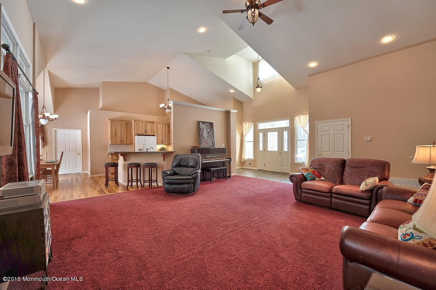 33 Larrison Road Wrightstown, NJ 08562 - Photo 15 of 35 a living room with furniture and a flat screen tv