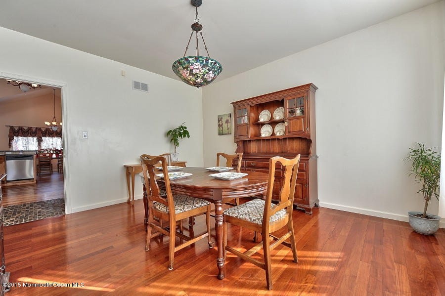 33 Larrison Road Wrightstown, NJ 08562 - Photo 17 of 35 a view of a dining room with furniture wooden floor and chandelier