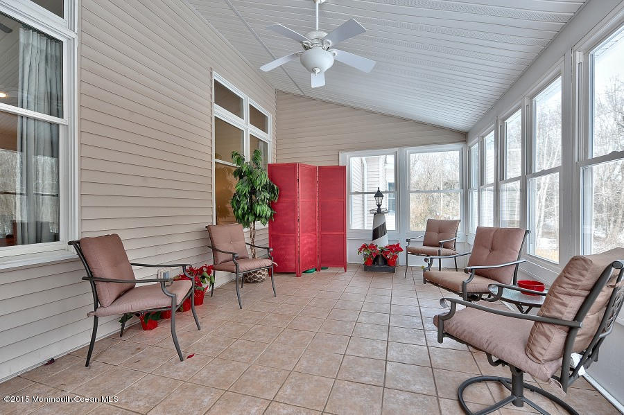 33 Larrison Road Wrightstown, NJ 08562 - Photo 19 of 35 a living room with furniture and a floor to ceiling window