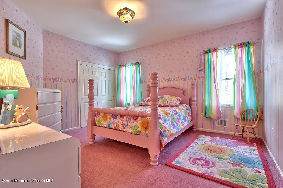 33 Larrison Road Wrightstown, NJ 08562 - Photo 24 of 35 a bedroom with a bed and wooden floor