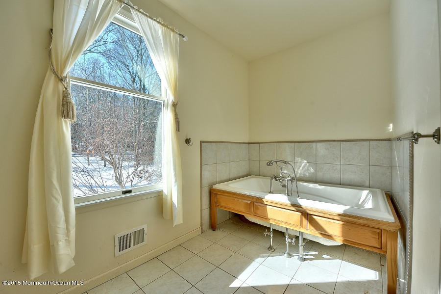 33 Larrison Road Wrightstown, NJ 08562 - Photo 26 of 35 a bathroom with a sink and bathtub