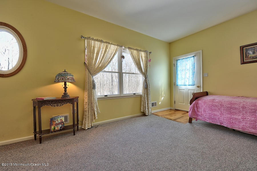 33 Larrison Road Wrightstown, NJ 08562 - Photo 28 of 35 a bedroom with a bed and a window