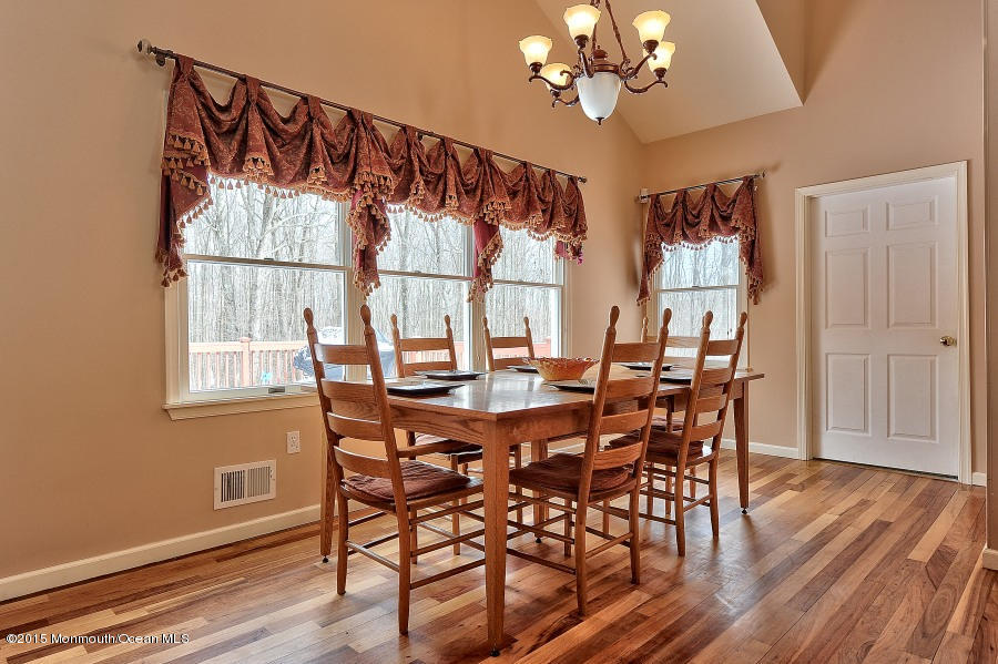 33 Larrison Road Wrightstown, NJ 08562 - Photo 9 of 35 a view of a dining room with furniture wooden floor and chandelier