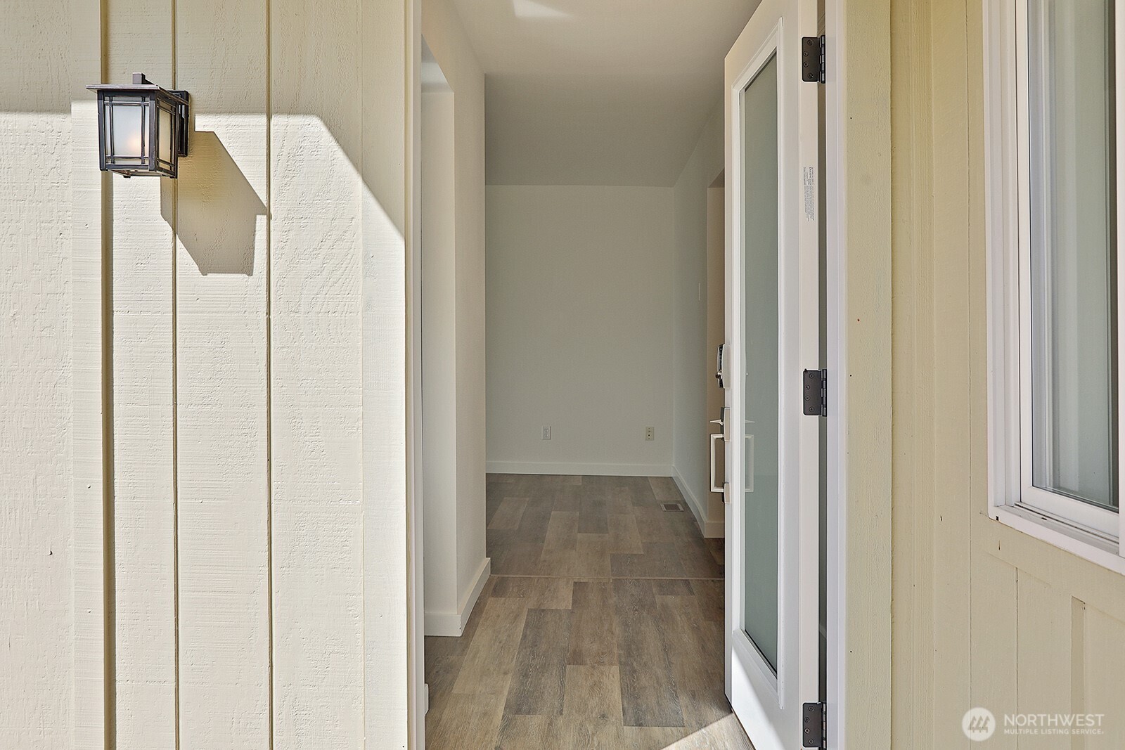 3760 Periwinkle Road Clinton, WA 98236 - Photo 9 of 34 a view of hallway with wooden floor