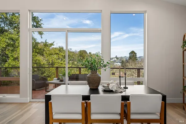 a view of a dining room with furniture window and outside view