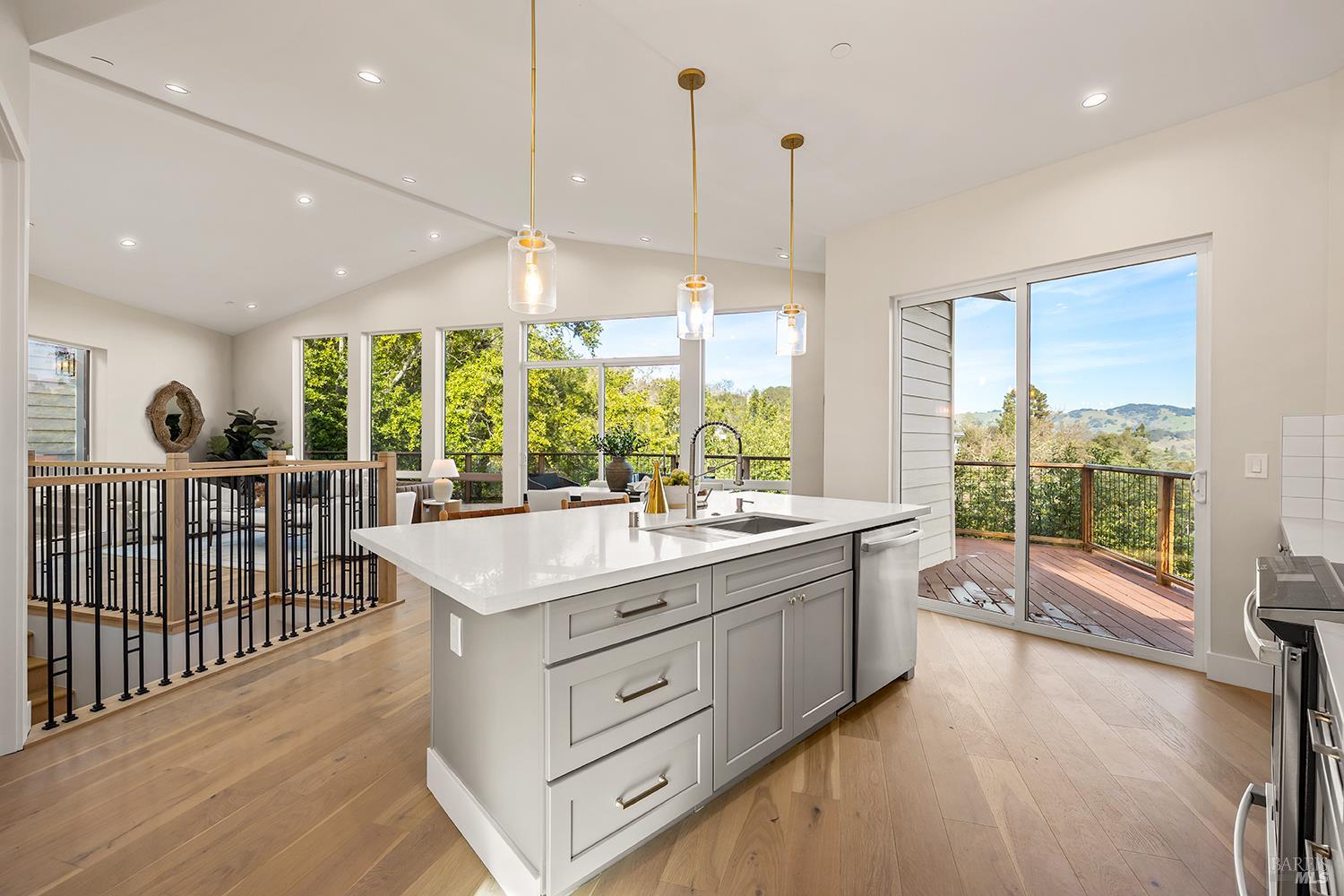 745 Redwood Road San Anselmo, CA 94960 - Photo 14 of 47 a kitchen with stainless steel appliances granite countertop a sink and a large window