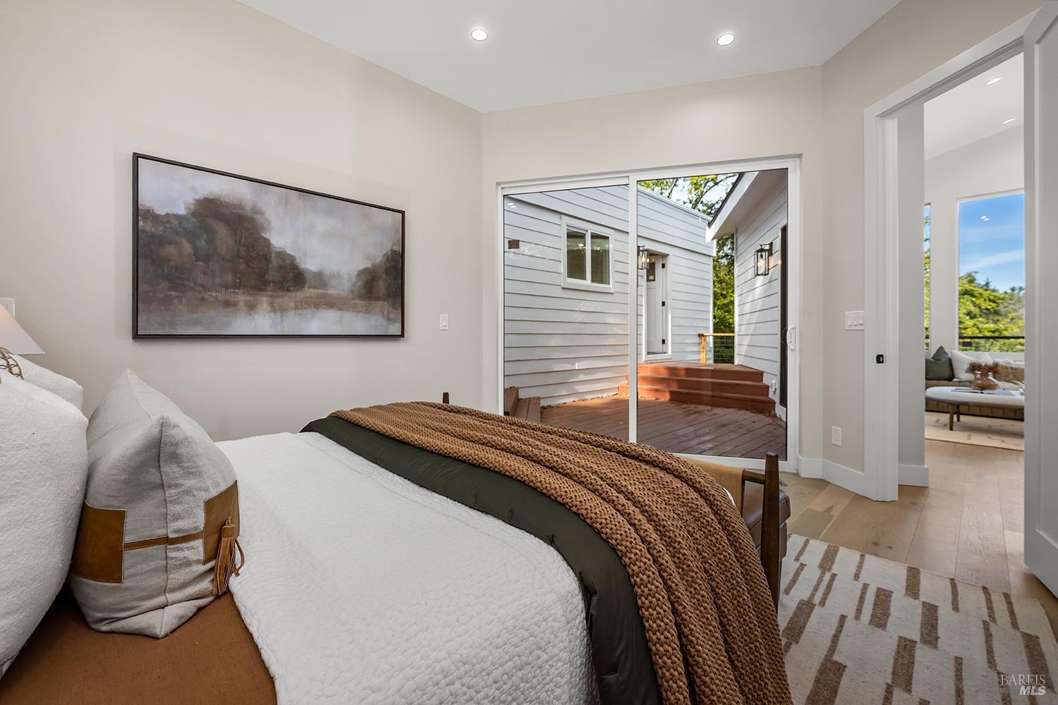 745 Redwood Road San Anselmo, CA 94960 - Photo 19 of 47 a bedroom with a bed and a painting on the wall