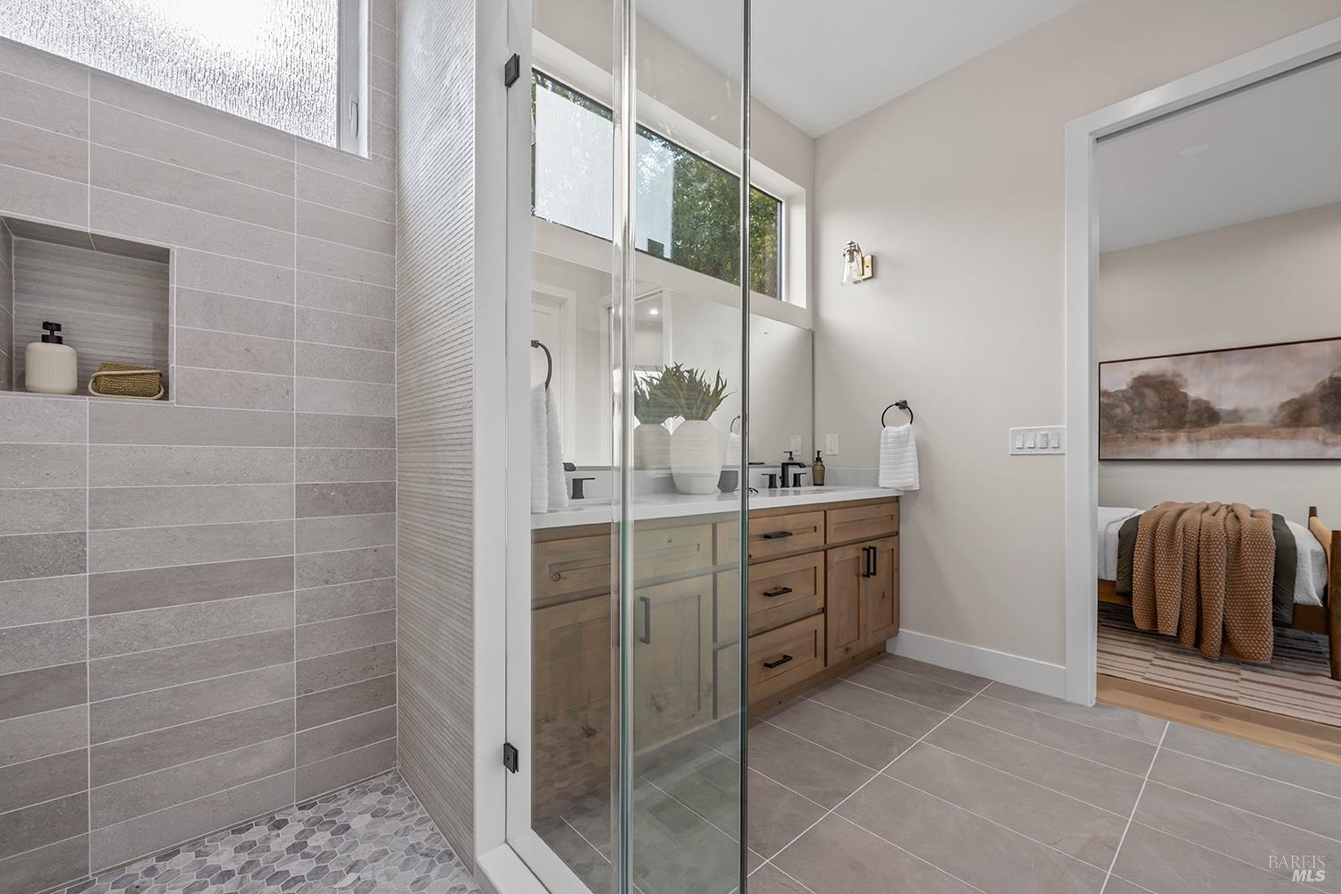 745 Redwood Road San Anselmo, CA 94960 - Photo 22 of 47 a spacious bathroom with a double vanity sink a mirror and a shower