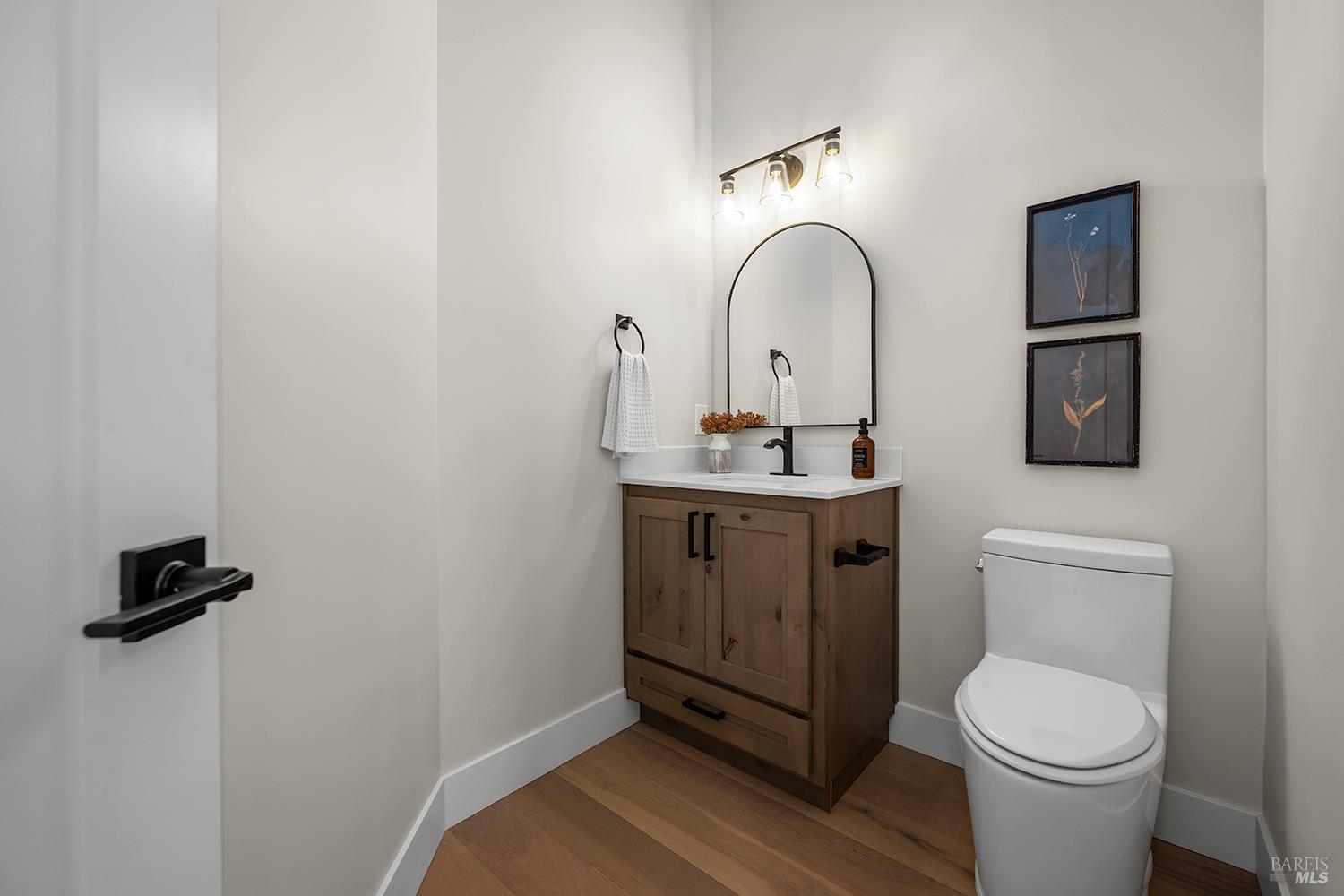 745 Redwood Road San Anselmo, CA 94960 - Photo 25 of 47 a bathroom with a toilet sink and mirror