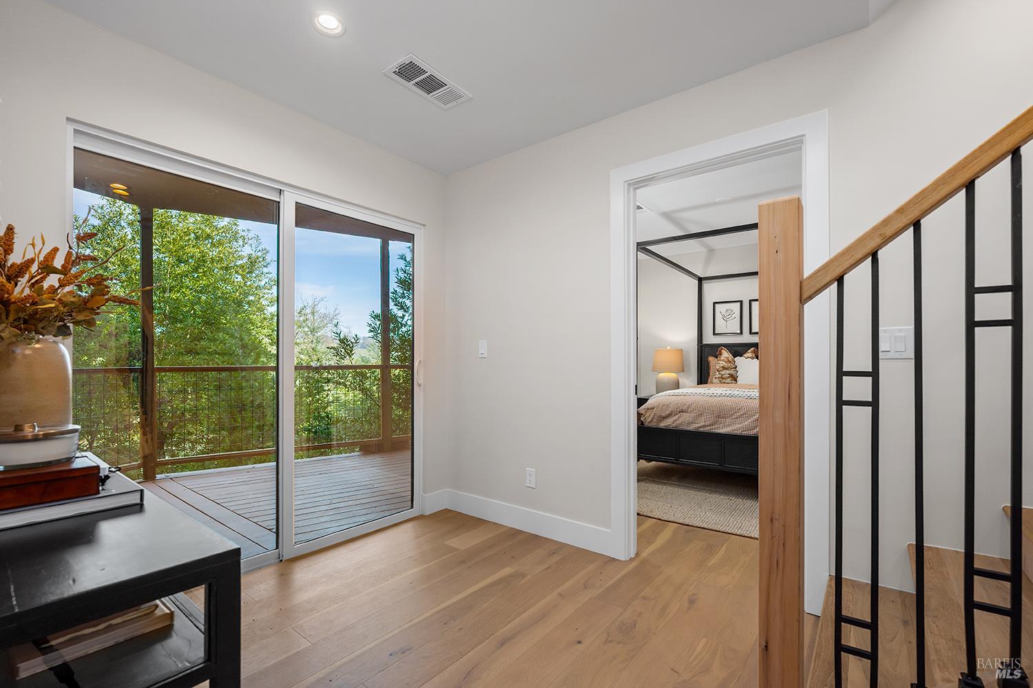 745 Redwood Road San Anselmo, CA 94960 - Photo 26 of 47 a view of a bedroom with a bed and wooden floor