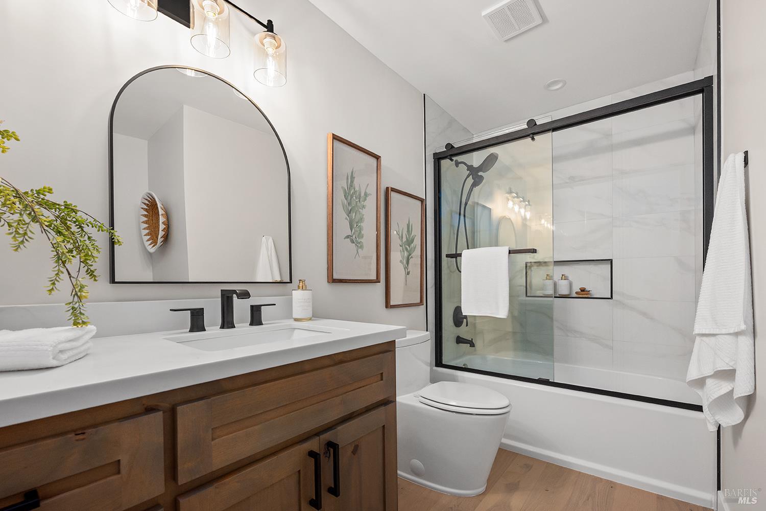 745 Redwood Road San Anselmo, CA 94960 - Photo 32 of 47 a bathroom with a granite countertop sink mirror vanity and toilet