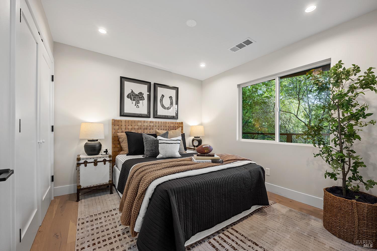 745 Redwood Road San Anselmo, CA 94960 - Photo 33 of 47 a bedroom with a large bed and a potted plant
