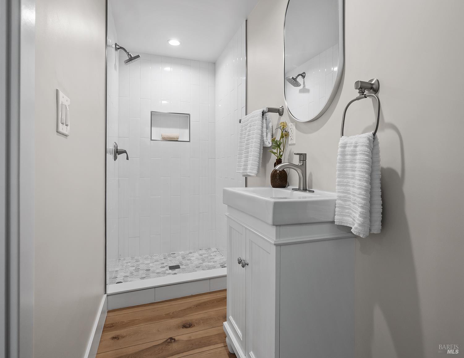 745 Redwood Road San Anselmo, CA 94960 - Photo 40 of 47 a bathroom with a sink mirror and shower