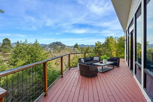 a view of a balcony with wooden floor