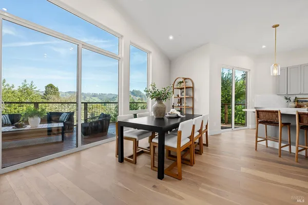 a view of a dining room with furniture window and outside view