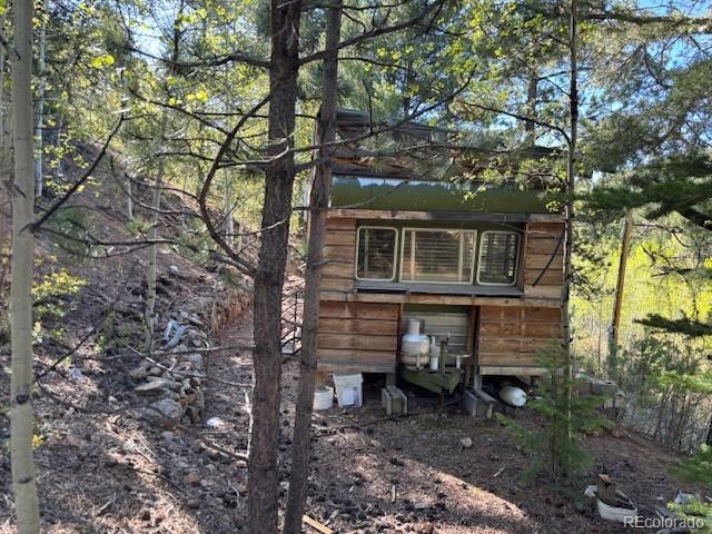 7394 County Road 43 Bailey, CO 80421 - Photo 5 of 12 a view of a house with a yard