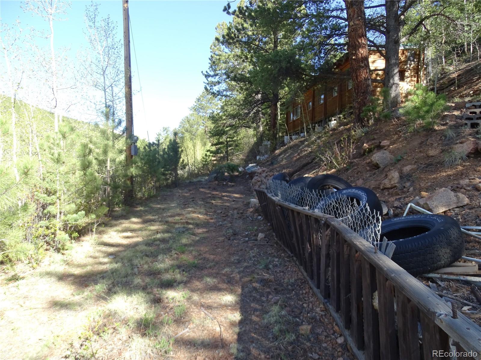 7394 County Road 43 Bailey, CO 80421 - Photo 9 of 12 a view of balcony and wooden fence
