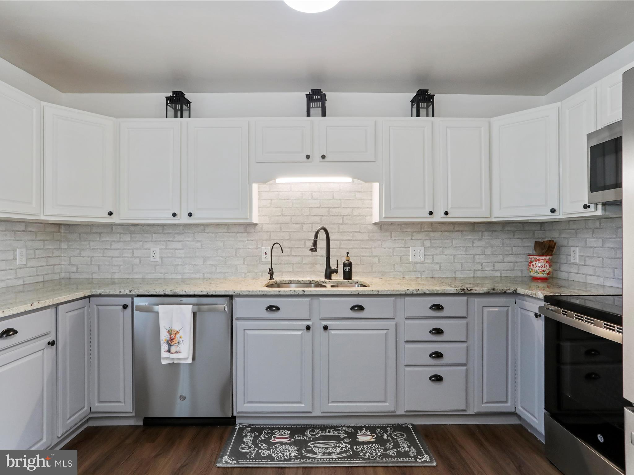 12530 Ashton Road Clear Spring, MD 21722 - Photo 15 of 57 a kitchen with stainless steel appliances a sink stove and cabinets
