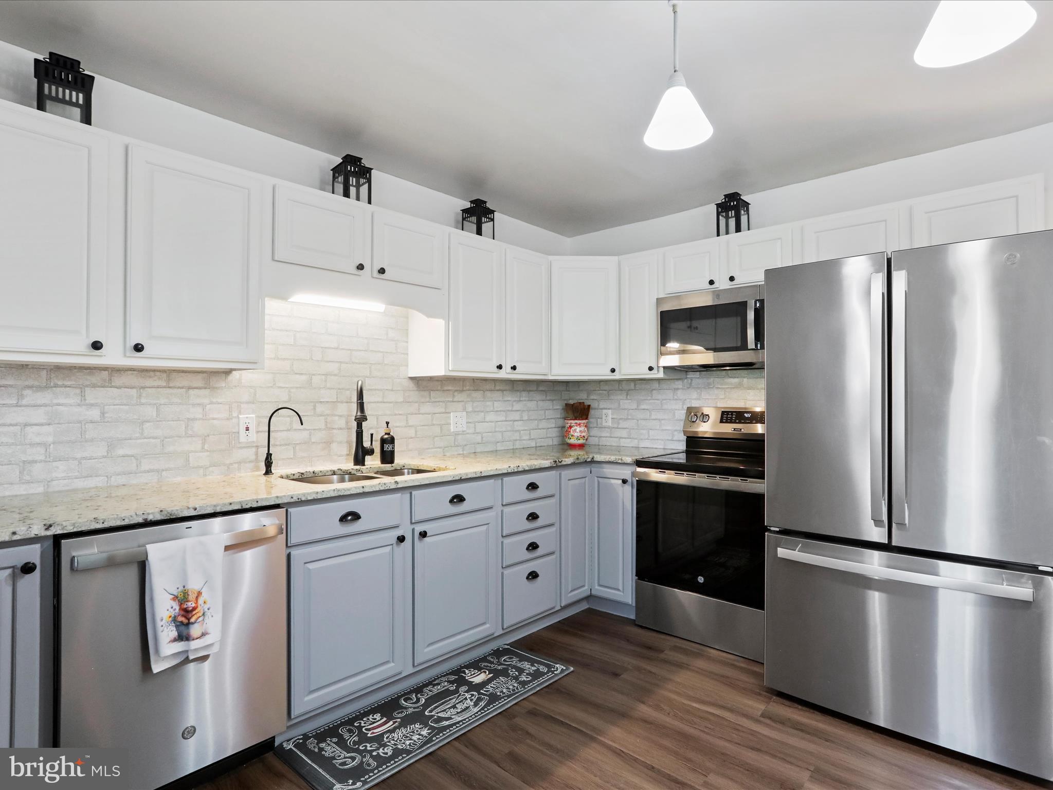 12530 Ashton Road Clear Spring, MD 21722 - Photo 16 of 57 a kitchen with stainless steel appliances a refrigerator sink and cabinets
