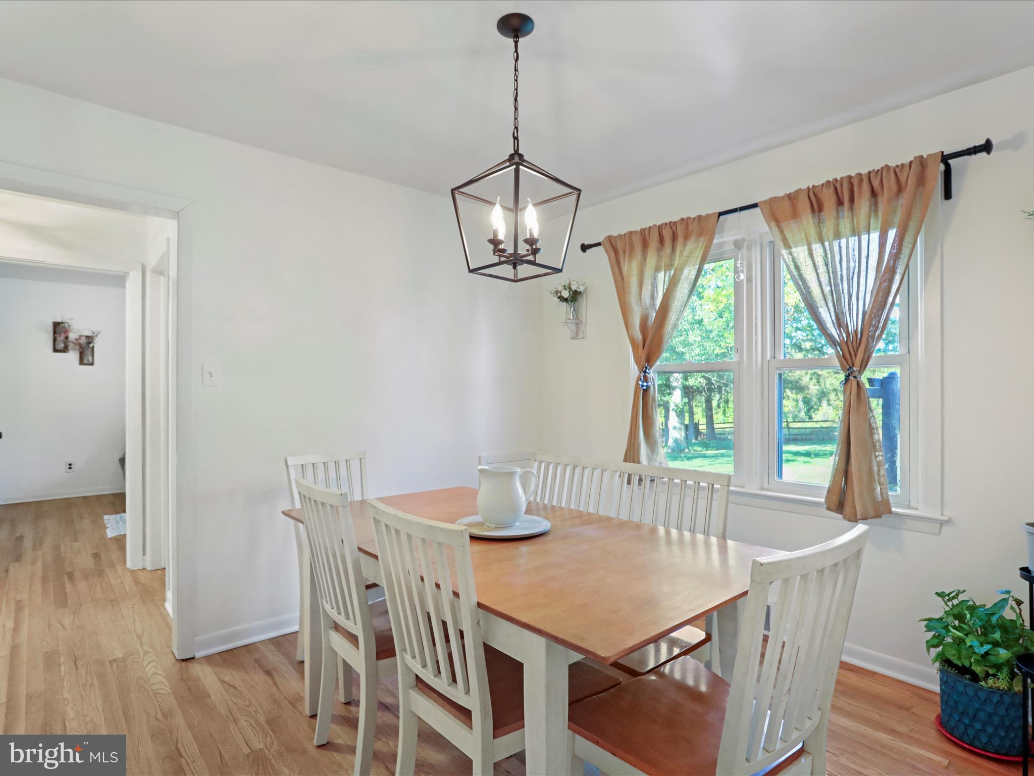 12530 Ashton Road Clear Spring, MD 21722 - Photo 20 of 57 a dining room with furniture a chandelier and wooden floor