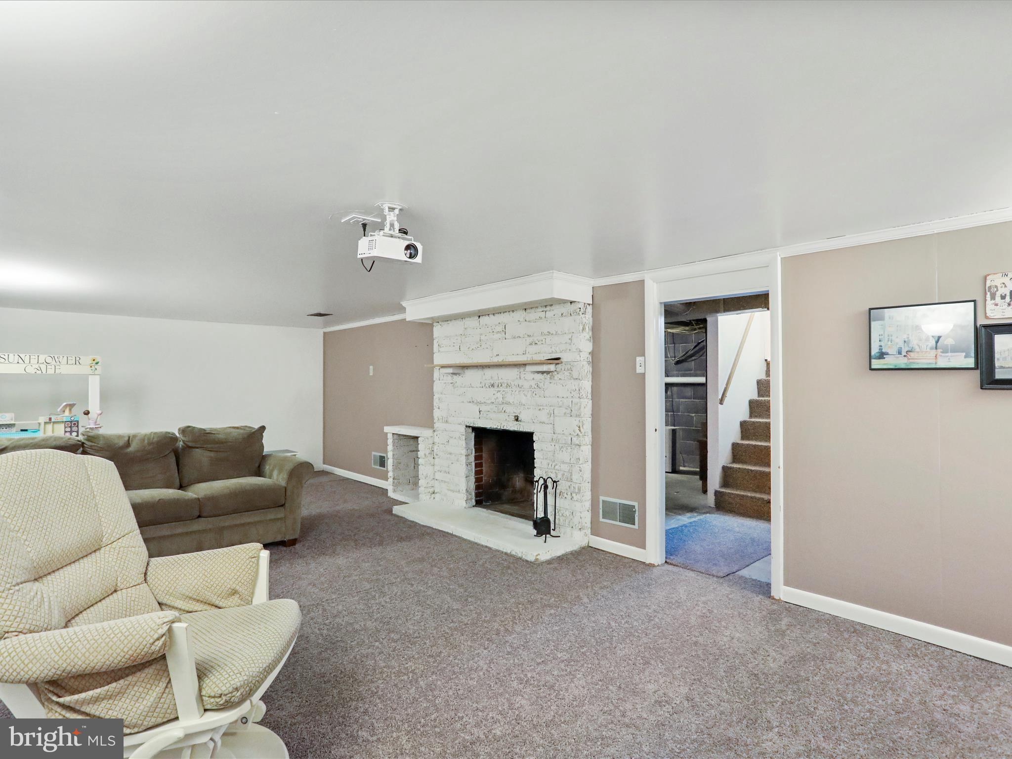 12530 Ashton Road Clear Spring, MD 21722 - Photo 28 of 57 a living room with furniture and a fireplace