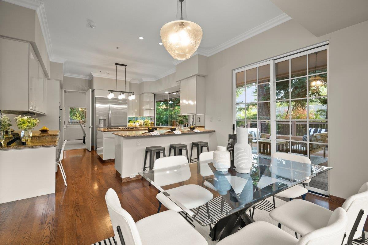 639 Morningside Road Los Altos, CA 94022 - Photo 11 of 42 a dining room with furniture a chandelier and wooden floor