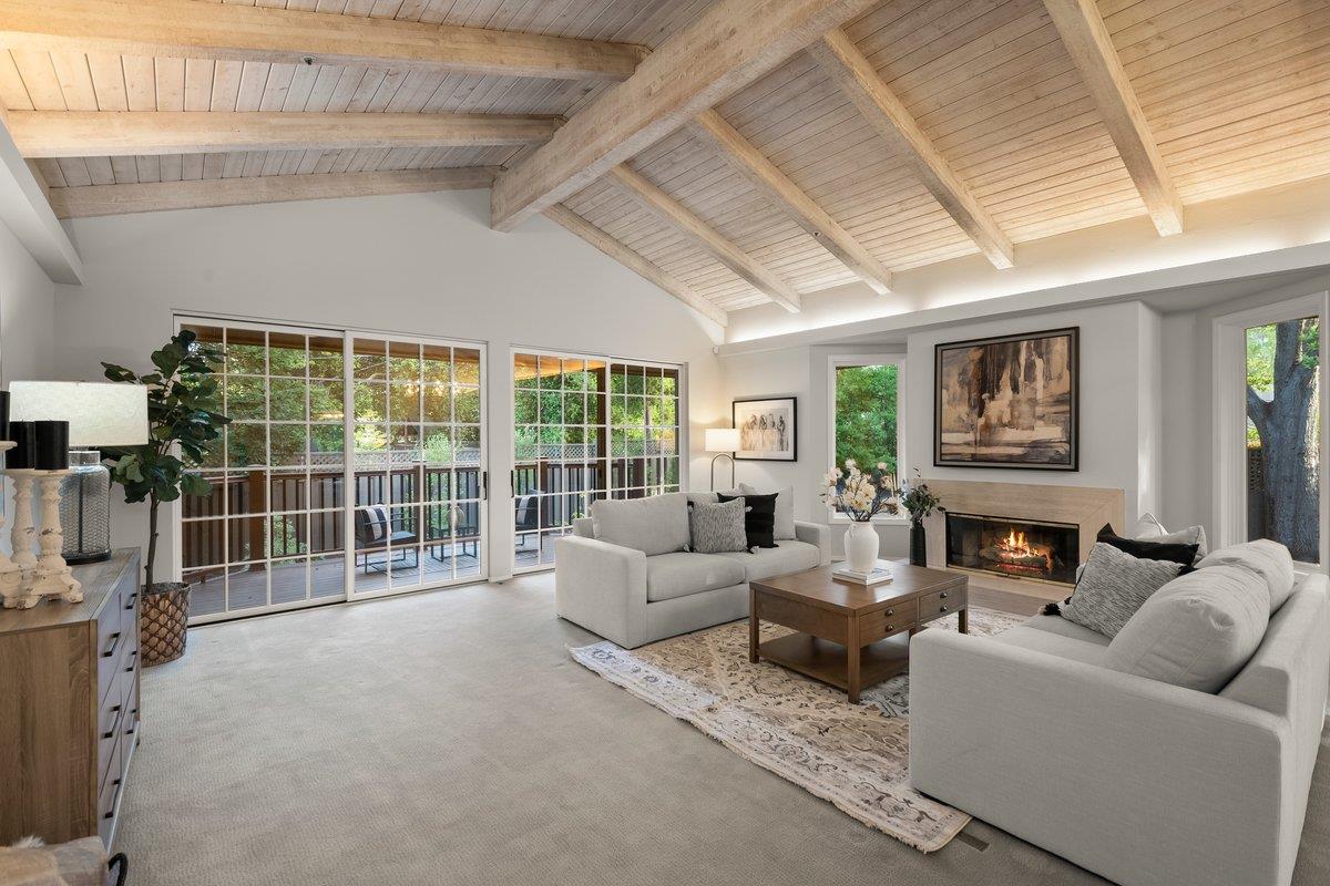 639 Morningside Road Los Altos, CA 94022 - Photo 19 of 42 a living room with furniture a flat screen tv and a large window